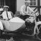 Jimmy Murphy, winner of 500-mile auto race at Indianapolis in May 1922, and Ernie Olson, mechanic, seated on Harley-Davidson motorcycle and in sidecar.